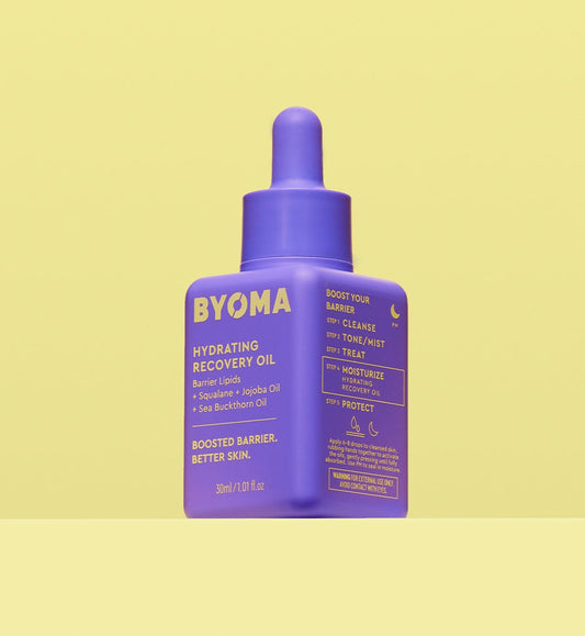 BYOMA Hydrating Recovery Oil in a bold purple bottle.