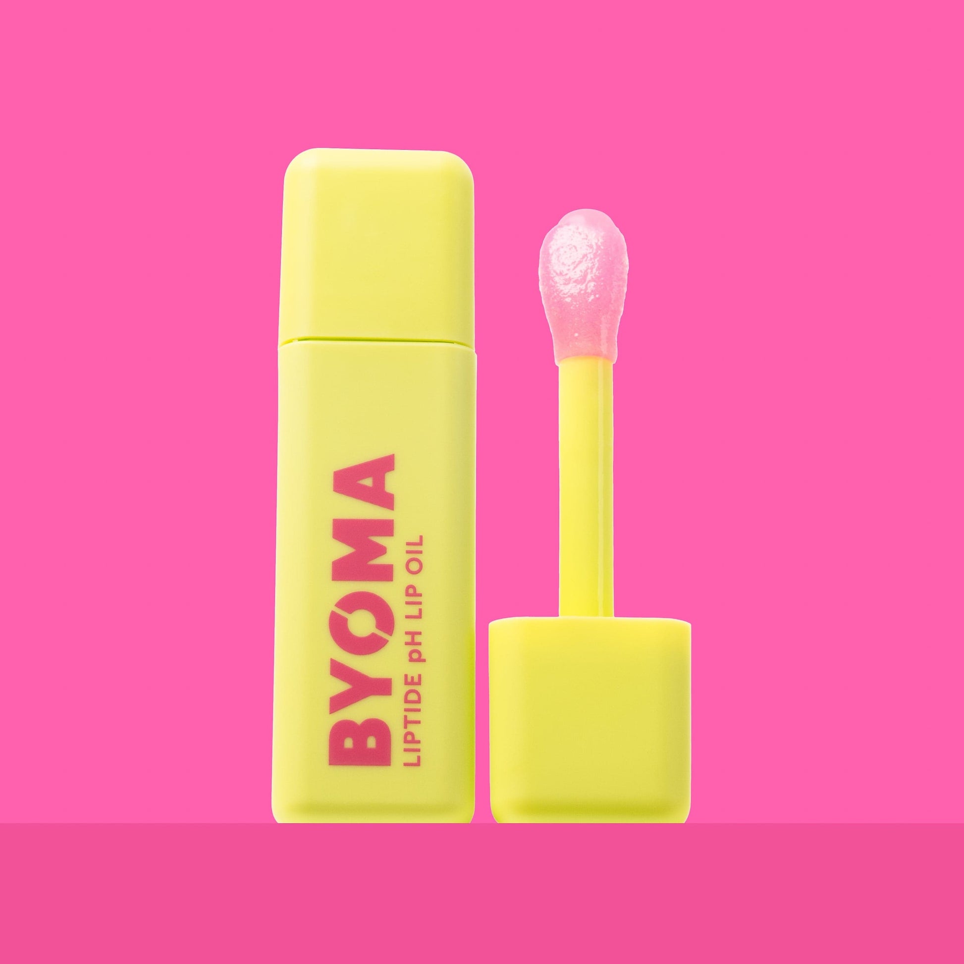A BYOMA Liptide pH Lip Oil bottle with its applicator removed.
