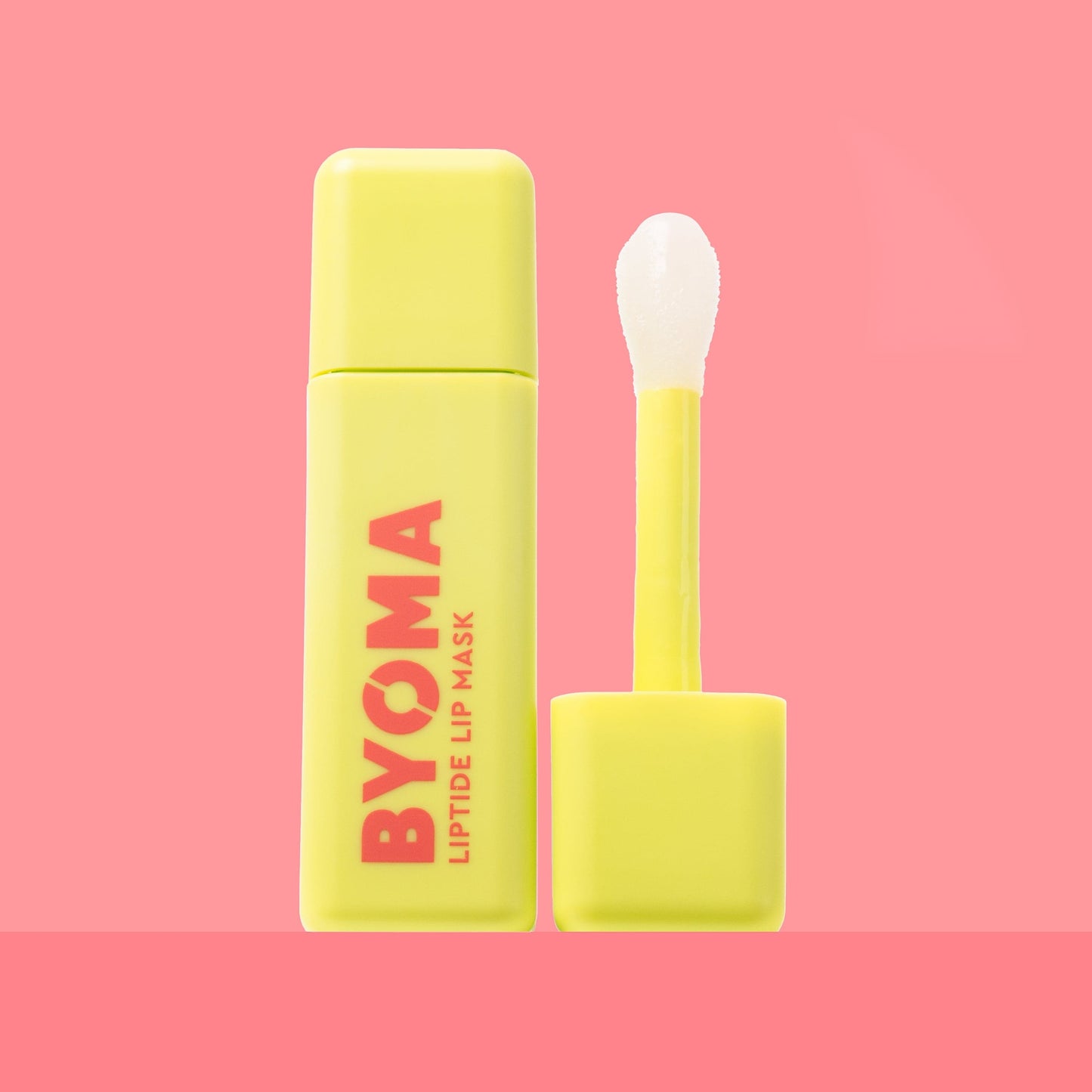 BYOMA Liptide Lip Mask in a vibrant yellow bottle.