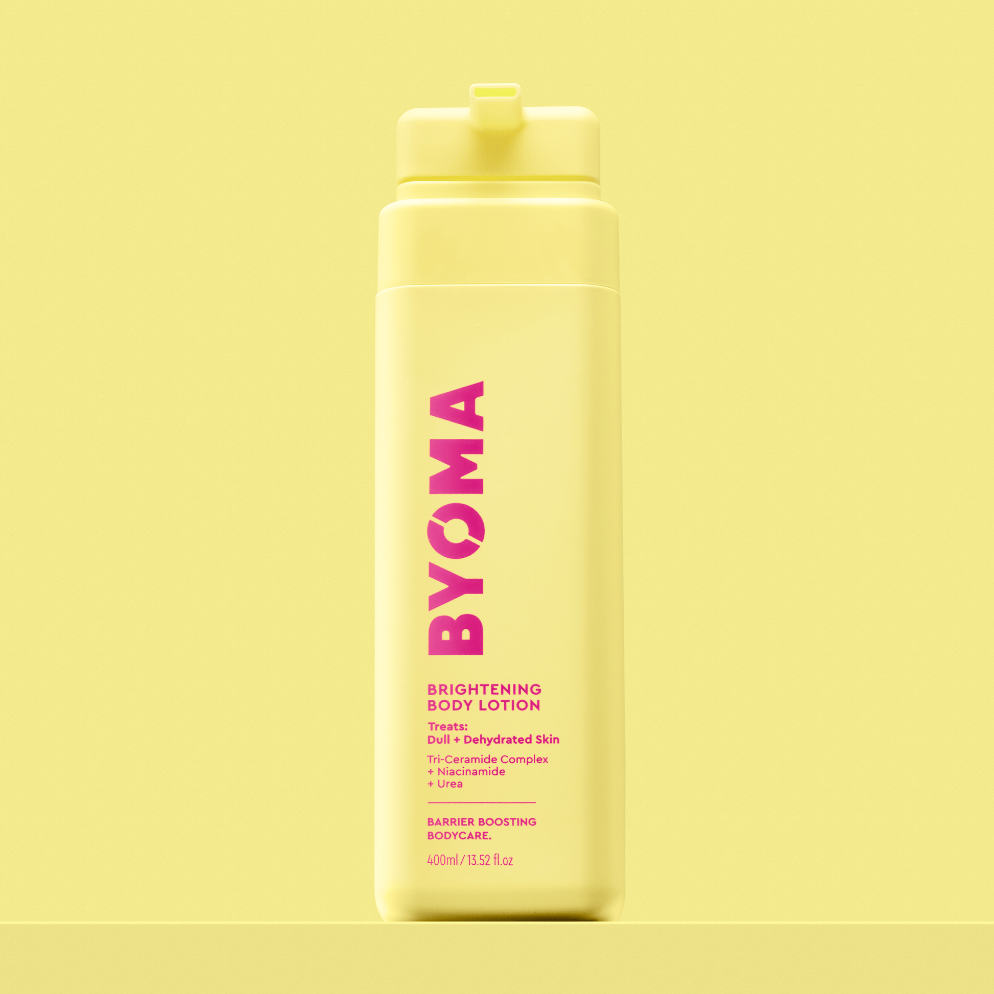 BYOMA Brightening Body Lotion in a yellow bottle.