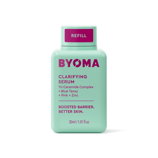A BYOMA Clarifying Serum refill bottle in mint green.