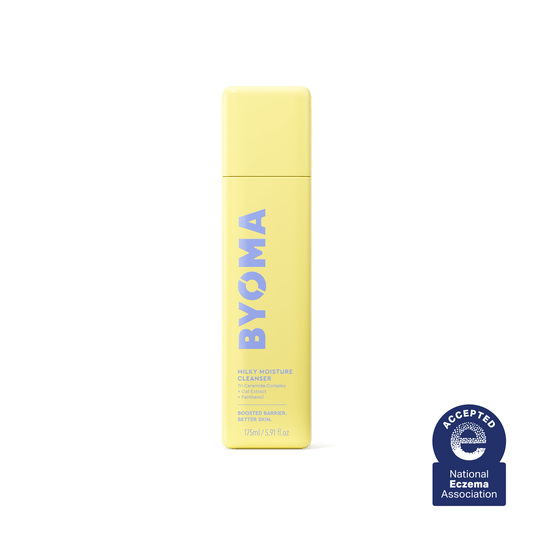 A yellow bottle of Byoma Milky Moisture Cleanser with the National Eczema Association seal.