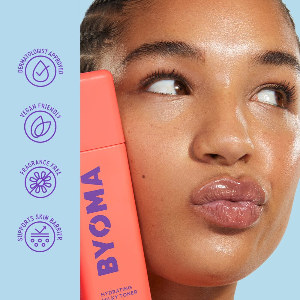 Woman holding a BYOMA skincare product with brand icons on a light blue background
