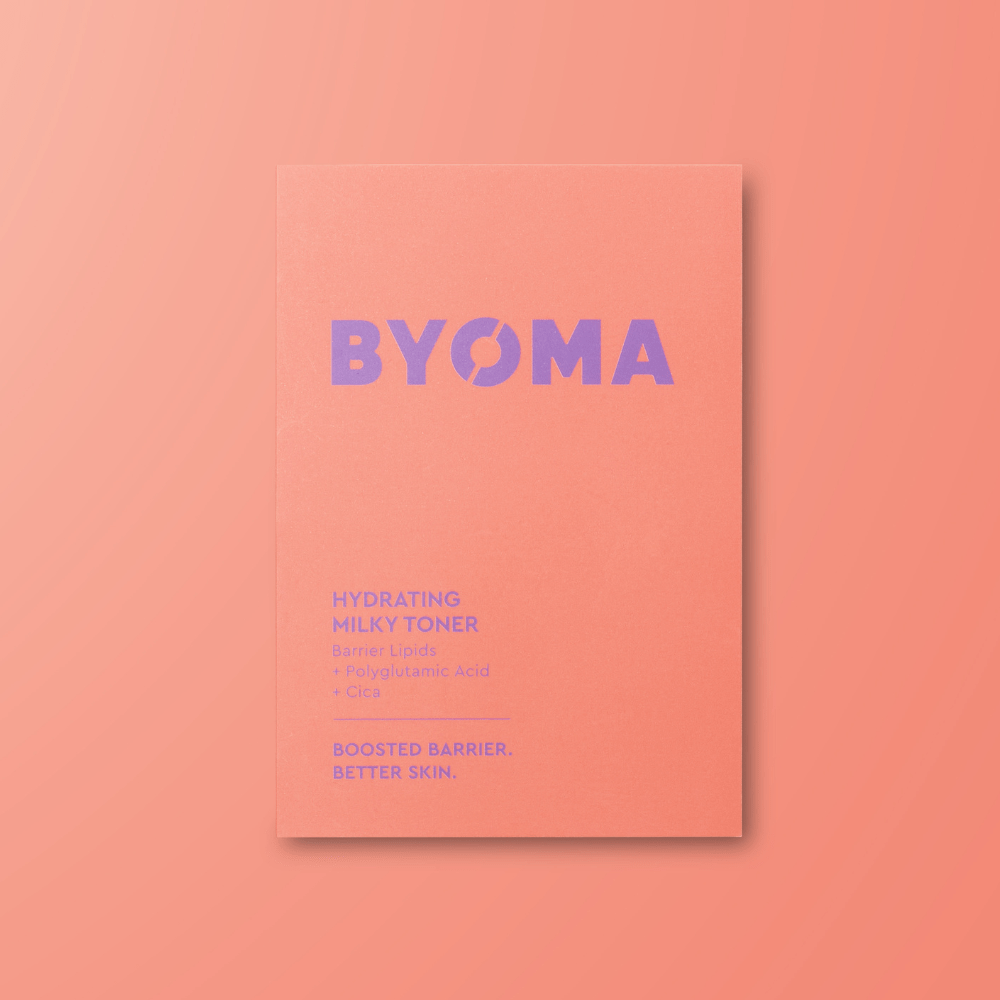 BYOMA hydrating milky toner sample on a peach background