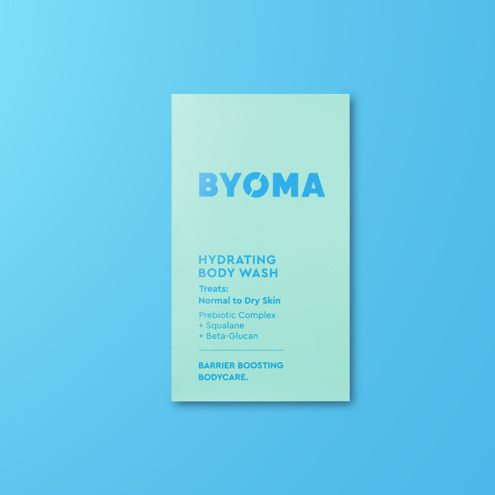 BYOMA hydrating body wash sample on a blue background