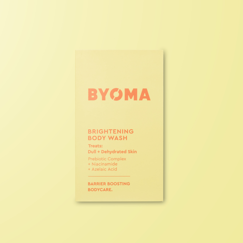 BYOMA brightening body wash sample on a light yellow background